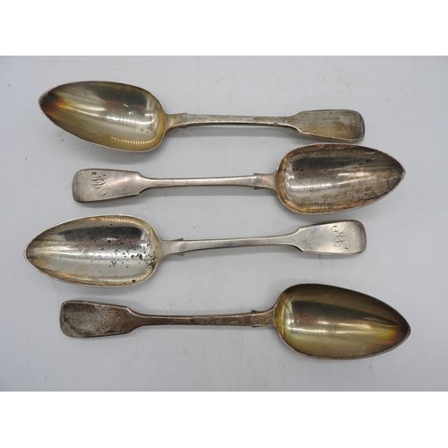 543 - A SET OF FOUR GEORGE III SILVER SERVING SPOONS, fiddle pattern, two with engraved monogram, bears th... 