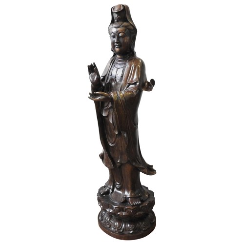 492 - A LARGE CAST BRONZE GUANYIN FIGURE, modelled in a standing traditional pose with flowing robes, the ... 