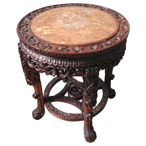 109 - AN ORNATE CHINESE HARDWOOD STAND, 20TH CENTURY, circular lotus form top inset with biege marble pane... 