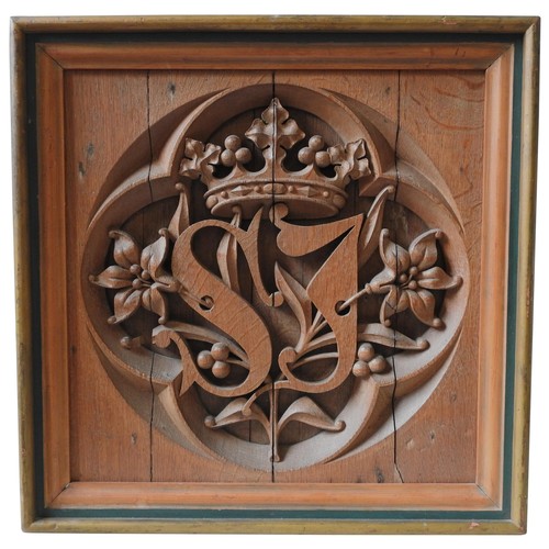 590 - A 19TH CENTURY CARVED OAK QUATREFOIL PANEL, the interior carved with the initials S.J, surmounted by... 