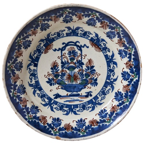 694 - A RARE BRISTOL POLYCHROME DELFT CHARGER18TH CENTURYdecorated in tones of blue, red and green with a ... 