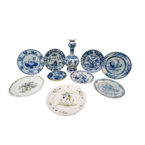 300 - A MIXED GROUP OF NINE DELFT DISHES AND A BOTTLE VASE, 18TH CENTURY AND LATER, the dishes include two... 