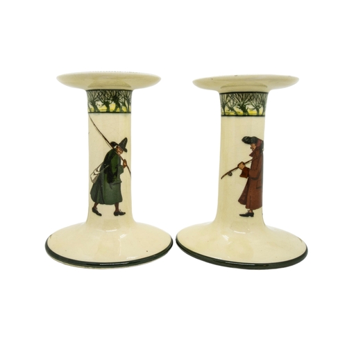 303 - A PAIR OF LARGE ROYAL DOULTON CANDLESTICKS AND ADMIRAL BEATTY JUG, the sides of the cream coloured c... 