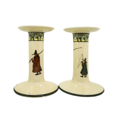 303 - A PAIR OF LARGE ROYAL DOULTON CANDLESTICKS AND ADMIRAL BEATTY JUG, the sides of the cream coloured c... 