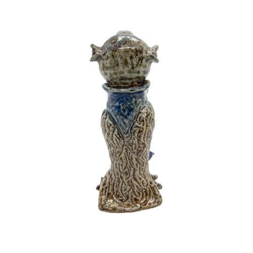 319 - IN THE MANNER OF ROBERT WALLACE MARTIN, A 'WALLY BIRD' JAR AND COVER, modelled standing, in blue and... 