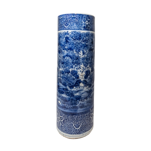 240 - A CHINESE BLUE AND WHITE CERAMIC STICK STAND, LATE QING DYNASTY, the cylindrical sides decorated wit... 