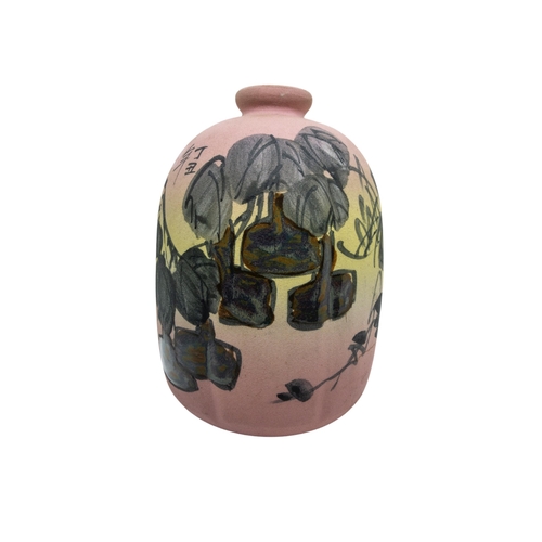 181 - A JAPANESE LOBED LANTERN FORM VASE, the matte porcelain sides painted with peach blossoms, the peach... 