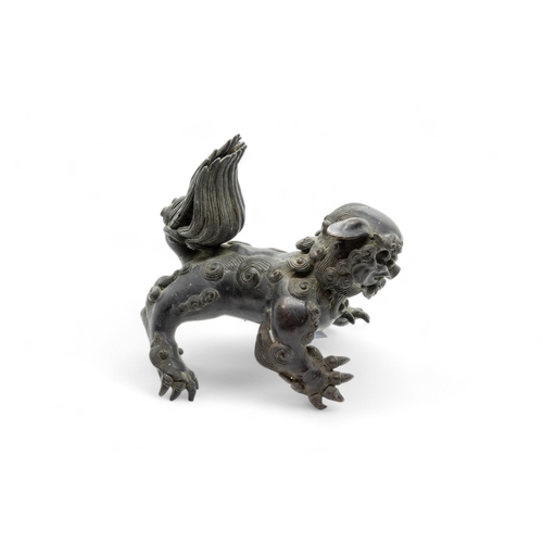 246 - A CHINESE BRONZE FIGURE OF A BUDDHIST LION17TH / 18TH CENTURY18cm high; together with A PATINATED-ME... 