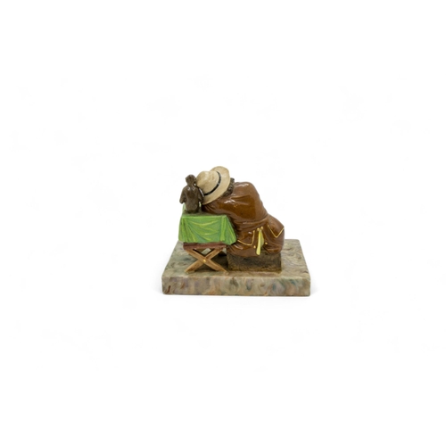 443 - A 19TH CENTURY FIGURAL GROUPA boy sleeping next to a performing monkey, 13cms wide