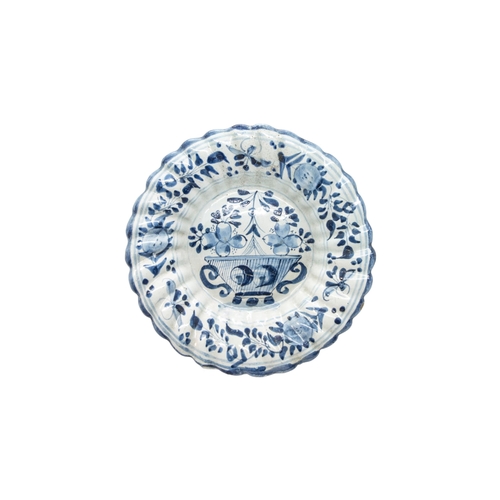 291 - SIX DELFT PLATES AND A SPANISH PLATE18th century