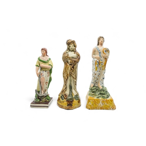 448 - THREE PEARLWARE FIGURESEarly 19th century, tallest is 23cms high