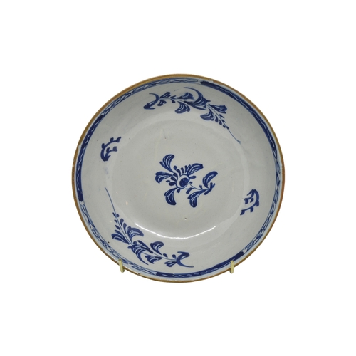 296 - TWO DELFT CHARGERSMid 18th century, once with two figures in European dress, together with a delft b... 