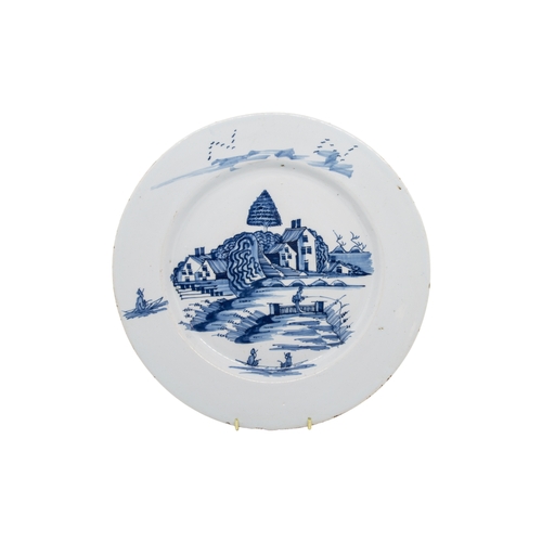 296 - TWO DELFT CHARGERSMid 18th century, once with two figures in European dress, together with a delft b... 