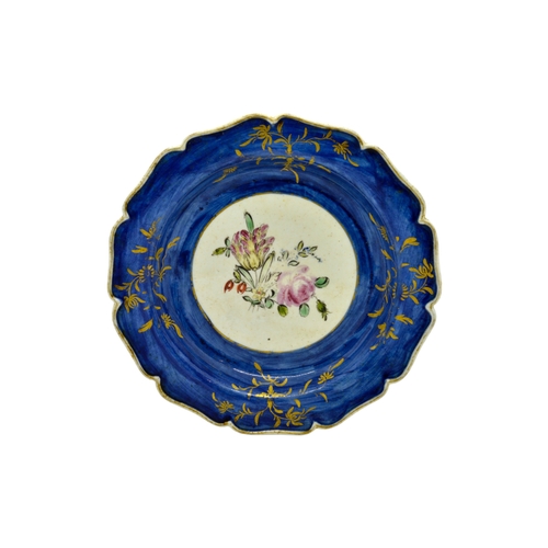 461 - A MID 18TH CENTURY PLATEWith central floral spray, 18cms wide