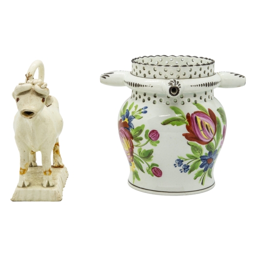 466 - A WILLIAM FIFEILD BRISTOL PUZZLE JUGCirca 1830, together with creamware cow creamer, 12cms high... 