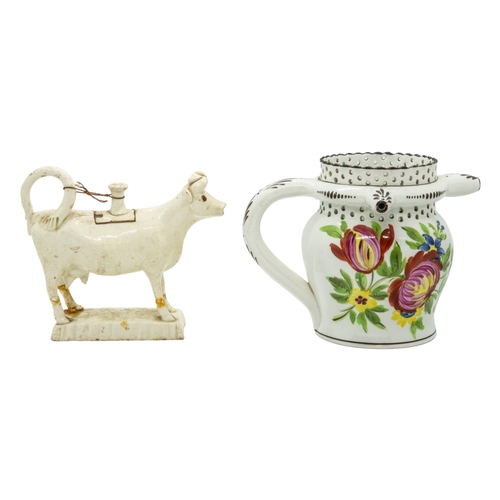 466 - A WILLIAM FIFEILD BRISTOL PUZZLE JUGCirca 1830, together with creamware cow creamer, 12cms high... 