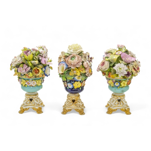 487 - A PAIR OF DERBY FLORAL VASESCirca 1830, and a further vase, 37cms high