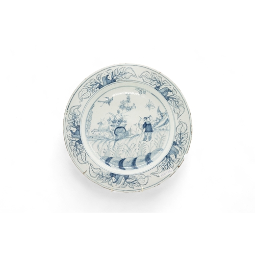 278 - FOUR DELFT CHARGERS18th Century, and a faience charger, 36cms wide