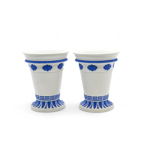 528 - A PAIR OF WEDGWOOD BOUGH POTS19th century, together with another bough pot with dolphin handles, 15.... 