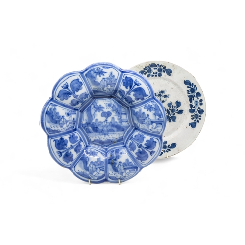 522 - A LATE 17TH / 18TH CENTURY LOBED FAIENCE DISHTogether with seven 18th century delft plates, 25cms wi... 