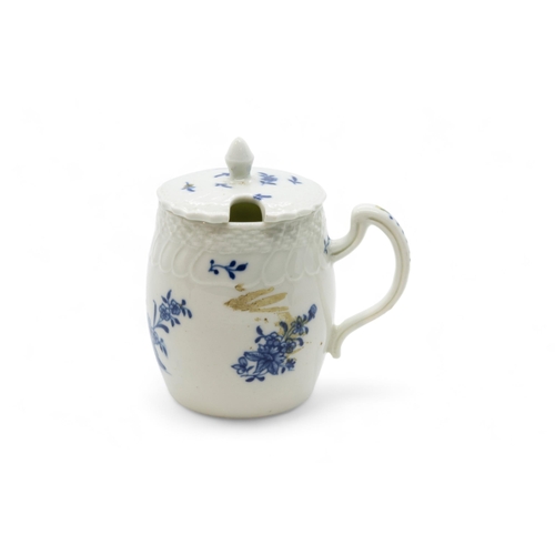 399 - AN 18TH CENTURY TANKARDTogether with a blue and white mustard pot and a barrel form tankard, 16.5cms... 