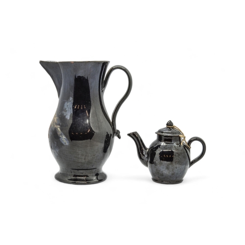 375 - A LARGE JACKFIELD WARE SPARROW BEAK JUG AND A TEAPOTMid 18th century, the jug with traces of cold pa... 