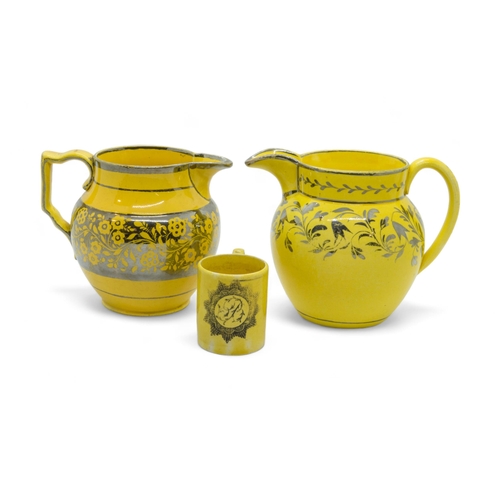 358 - TWO CANARY YELLOW AND SILVER LUSTRE JUGSCirca 1810, together with a miniature canary yellow mug and ... 