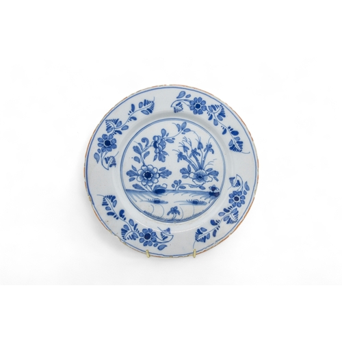 391 - THIRTEEN DELFT PLATES18th century and a speckled tin glazed plate, 22cms wide