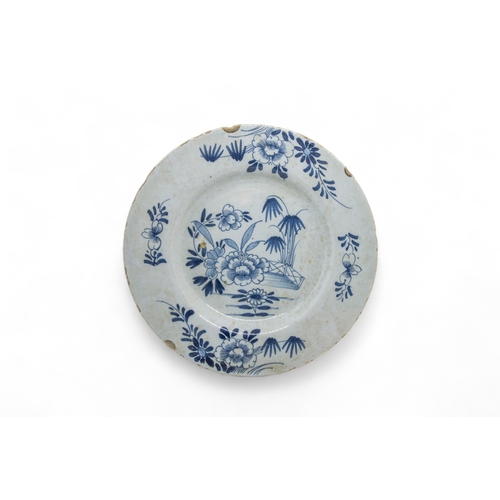 391 - THIRTEEN DELFT PLATES18th century and a speckled tin glazed plate, 22cms wide