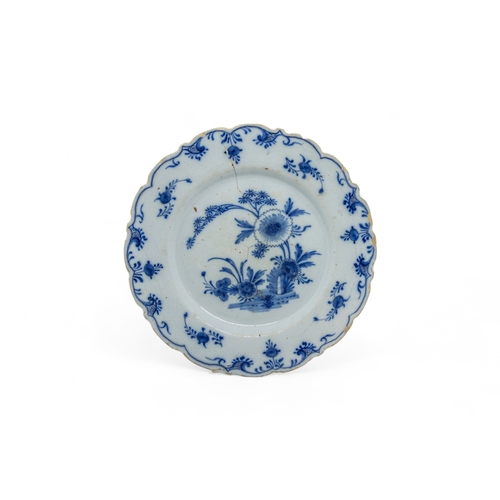 391 - THIRTEEN DELFT PLATES18th century and a speckled tin glazed plate, 22cms wide