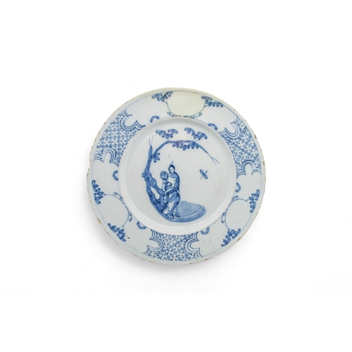 391 - THIRTEEN DELFT PLATES18th century and a speckled tin glazed plate, 22cms wide