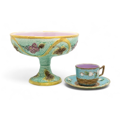 379 - A GEORGE JONES MAJOLICA CUP AND SAUCERLate 19th century, together with a majolica tazza, tazza is 22... 