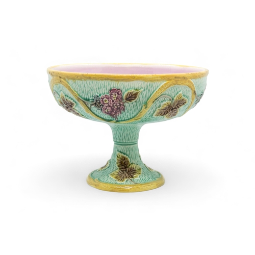 379 - A GEORGE JONES MAJOLICA CUP AND SAUCERLate 19th century, together with a majolica tazza, tazza is 22... 