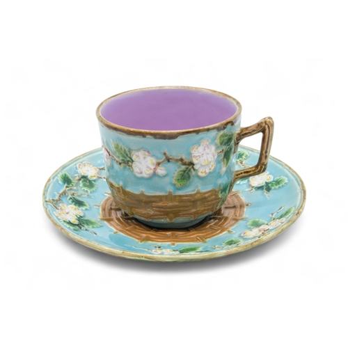 379 - A GEORGE JONES MAJOLICA CUP AND SAUCERLate 19th century, together with a majolica tazza, tazza is 22... 