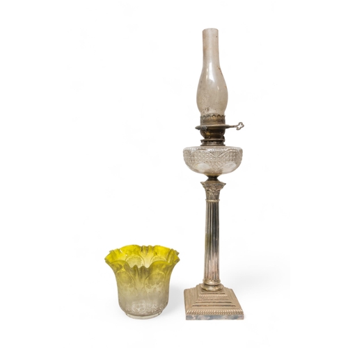 67 - A VICTORIAN OIL LAMP, the silver plated corinthian column base with cut glass reservoir and brass wi... 