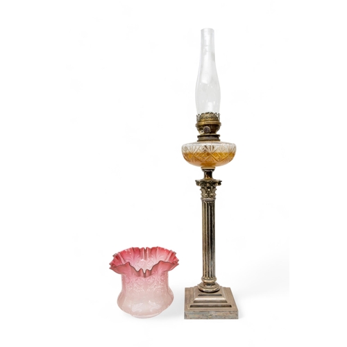 67 - A VICTORIAN OIL LAMP, the silver plated corinthian column base with cut glass reservoir and brass wi... 