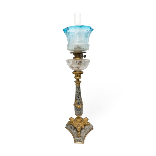 66 - A GOOD 19TH CENTURY POLISHED STONE OIL LAMP with gilt tri-form platform base and mounts with cut gla... 