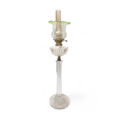 65 - A VICTORIAN OIL LAMP with hexagonal glass column and circular base with cut glass reservoir and moul... 