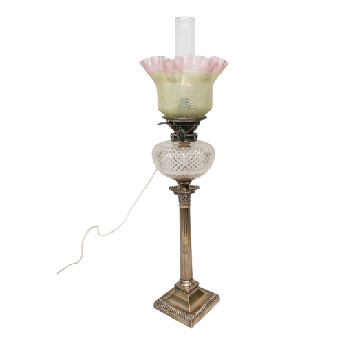 62 - A SILVER CORINTHIAN COLUMN OIL LAMP with cut glass reservoir and vaseline type shade. 66 cms max... 