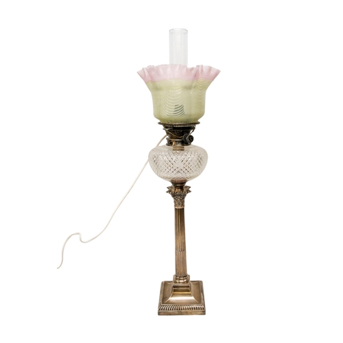 62 - A SILVER CORINTHIAN COLUMN OIL LAMP with cut glass reservoir and vaseline type shade. 66 cms max... 