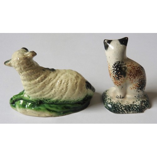 345 - A CREAMWARE SHEEP AND A PEARLWARE CATCirca 1800, sheep is 8cms