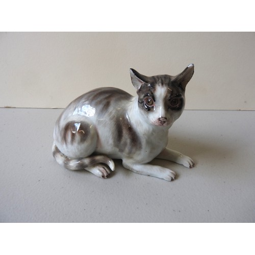 612 - A MEISSEN CAT19th CENTURYthe seated cat decorated with shades of brown,10cms high