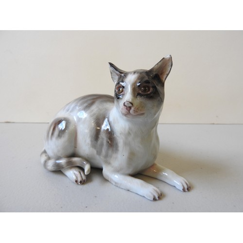 612 - A MEISSEN CAT19th CENTURYthe seated cat decorated with shades of brown,10cms high