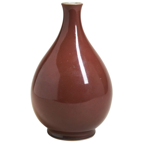 50 - A COPPER-RED GLAZED VASE, YUHUCHUNPINGYONGZHENG SIX CHARACTER MARK AND OF THE PERIOD the pear-shaped... 