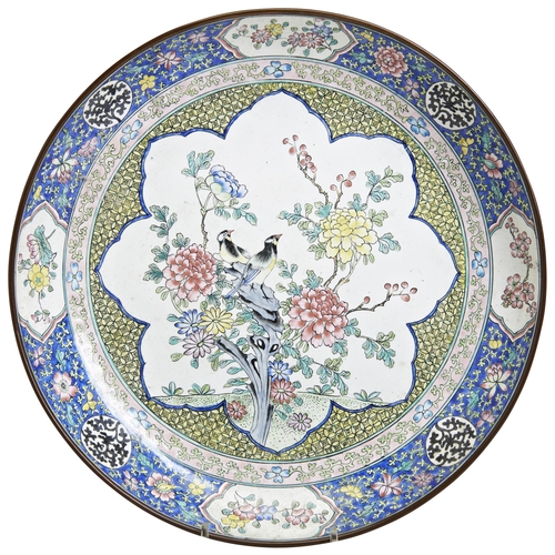 303 - A FAMILLE ROSE CANTON ENAMEL DISHQIANLONG PERIOD (1736-1795)painted with birds perched on rocks amid... 