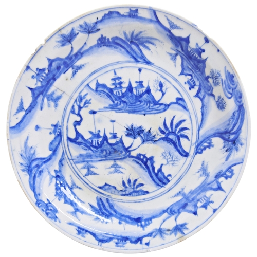 438 - A LARGE SAFAVID BLUE AND WHITE POTTERY DISHPERSIA, 17TH CENTURY十七世纪萨法维 波斯青花盘painted with a Chinese s... 