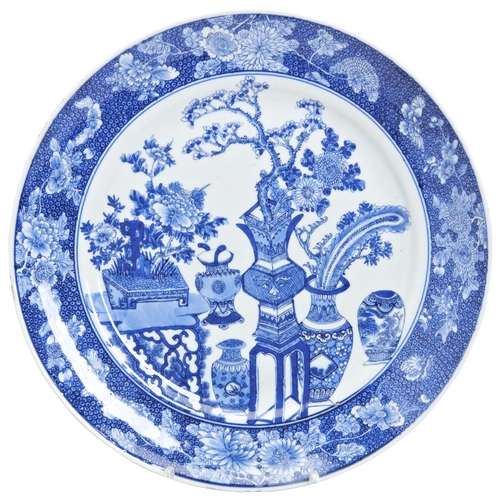 90 - A BLUE AND WHITE PORCELAIN DISH QING DYNASTY, QIANLONG MARK AND PERIOD interior painted with Bogu tu... 