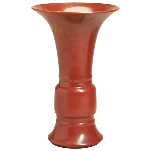 64 - A CORAL-RED GU FORM VASELATE QING / REPUBLIC PERIOD covered all over in a rich coral-red glaze, fitt... 