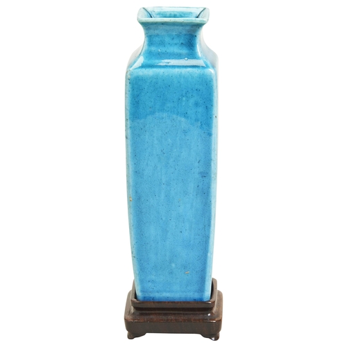 67 - A TURQUOISE-GLAZED SQUARE VASEQING DYNASTY, 18TH CENTURY清 孔雀绿釉方型瓶raised on a hardwood stand, fitted ... 