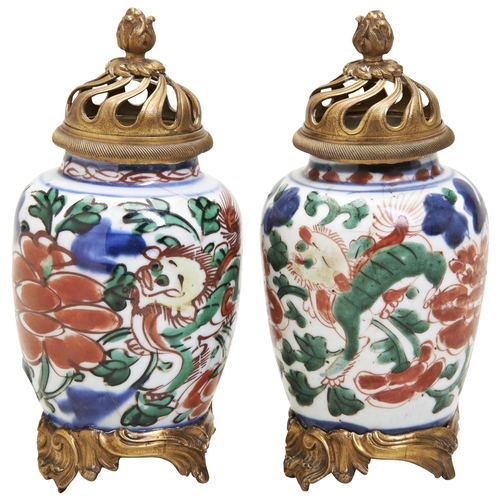 128 - A PAIR OF WUCAI BRONZE MOUNTED VASESPORCELAIN TRANSITIONAL PERIOD, 17TH CENTURYdecorated with qilins... 